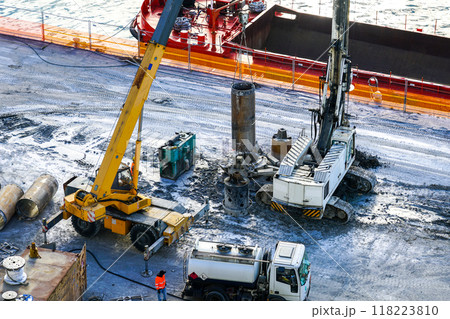 Installation of pile casings in the port quay, drilling rig, port infrastructure upgrade works 118223810