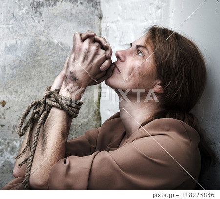 The bound prisoner sit on the floor The bound prisoner sit on the floor 118223836