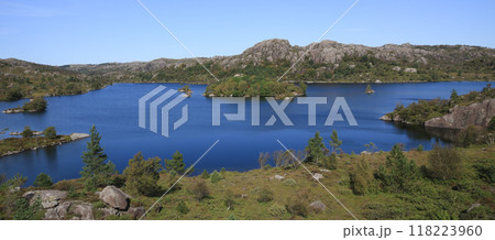 Beautiful Lake Fossvatnet and anorthosite rock formations in late summer, Egersund, Norway. 118223960