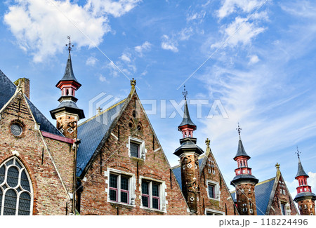 Bruges, Belgium; view of the medieval buildings that are crossed by the canals of the city. Historic center World Heritage	 118224496