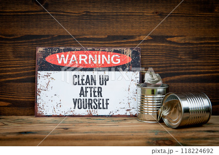 Clean up after yourself. Warning sign with text on wooden background 118224692