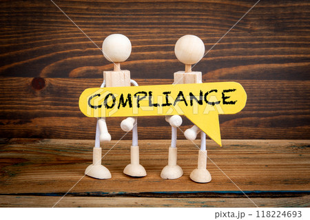 Compliance concept. Yellow speech bubble with word. Miniature human figures Compliance concept. Yellow speech bubble with word. Miniature human figures 118224693