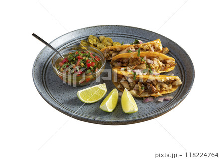 Delicious tacos filled with meat served on a plate. Delicious tacos filled with meat served on a plate. 118224764