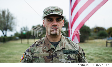 American Serviceman Military Salutes At Cemetery For Memorial Day American Serviceman Military Salutes At Cemetery For Memorial Day 118224847