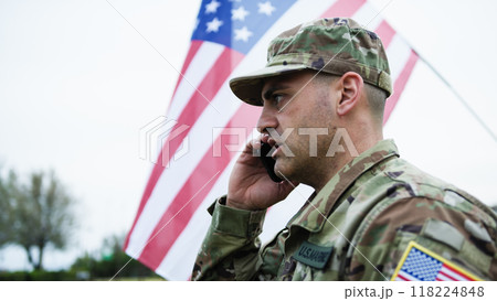 American Military Man Talks On The Phone With His Wife On The Base At War American Military Man Talks On The Phone With His Wife On The Base At War 118224848