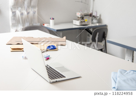 Empty cozy atelier of fashion designer dressmaker tailor workplace Empty cozy atelier of fashion designer dressmaker tailor workplace 118224958