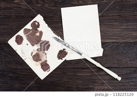 Retro envelope opener knife and vintage letter envelope 118225120