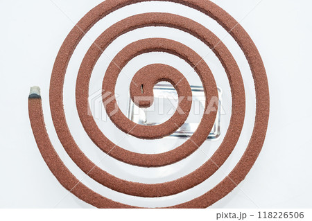 A mosquito coil with smoke coming out of it A mosquito coil with smoke coming out of it 118226506