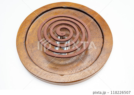 A mosquito coil with smoke coming out of it 118226507