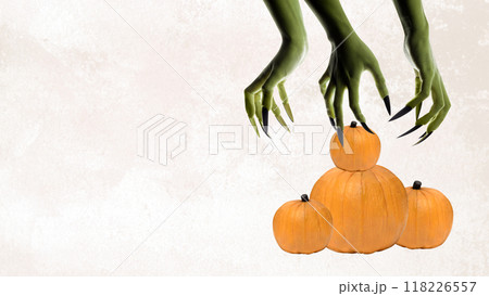 A Halloween themed poster with a green monster holding three pumpkins 118226557