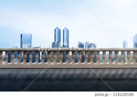 A city skyline with a clear blue sky and a few clouds 118226586