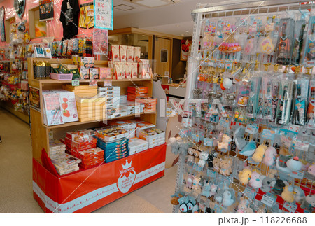 People walking along souvenirs  shop and food store near Dazaifu Tenmangu shrine entrance. : Many students visit the shrine to pray for success in their studies and 118226688