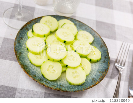 Sliced fresh cucumbers served in bowl Sliced fresh cucumbers served in bowl 118228049