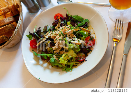 Salad with pieces of chicken, tomatoes and lettuce Salad with pieces of chicken, tomatoes and lettuce 118228155