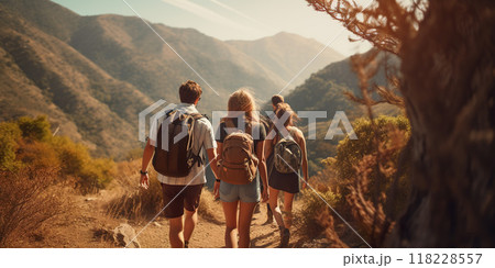 Group of friends hiking outdoors in wilderness, nature and mountains in the background. Hike trail, adventure, healthy activity concept 118228557