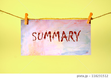 Conceptual summary word symbol. Copy space. Summary word written on a piece of paper in a clothespin on a rope on a yellow background 118231512