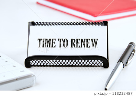 Conceptual time to renew concept. Copy space. Time to renew words written on a business card on a white background Conceptual time to renew concept. Copy space. Time to renew words written on a business card on a white background 118232487