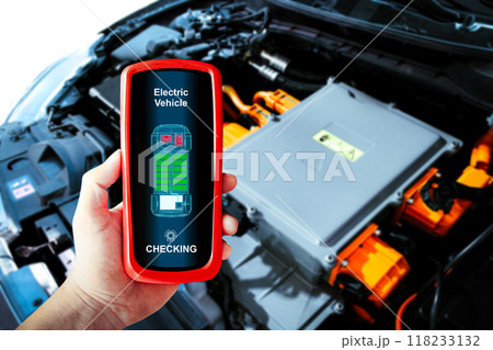 Car technician checking electric vehicle system problems with a wireless scan tool 118233132