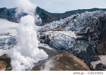 View of mountains and volcanoes from the edge of the crater 118235602