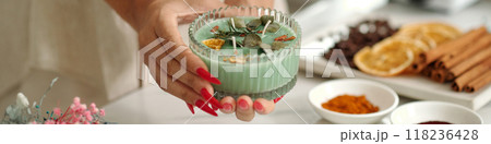 Woman With Handmade Candle With Aroma Herbs 118236428