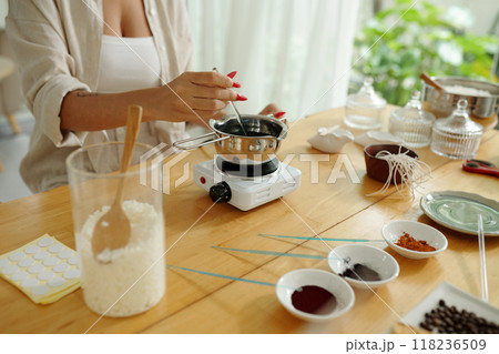 Woman Melting Wax With Aroma Materials Woman Melting Wax With Aroma Materials 118236509