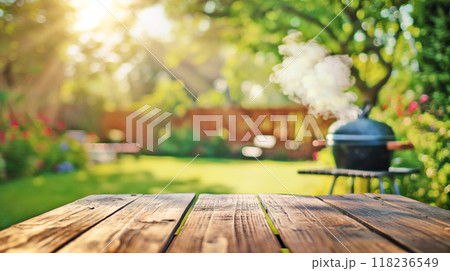 summer time party in backyard garden with grill BBQ, wooden table, blurred background 118236549