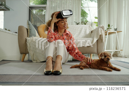 Woman Playing VR Games At Home 118236571
