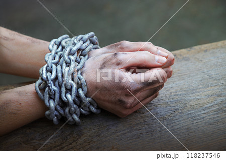 Women's hands in iron chains 118237546