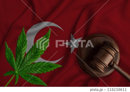 Cannabis leaf and judge gavel on the national flag of Turkey. Concept of legalization of marijuana 118238611