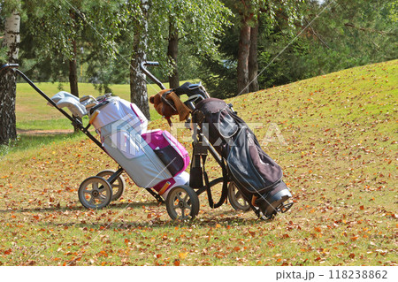 Golf equipment, clubs and bags at golf club in autumn. Background for design with copy space. Nature and sport. Modern lifestyle in nature.  118238862