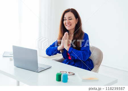 Business Woman Doing Meditation With Laptop Online Business Woman Doing Meditation With Laptop Online 118239387