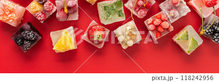 Ice cubes with frozen berries and fruits Ice cubes with frozen berries and fruits 118242956