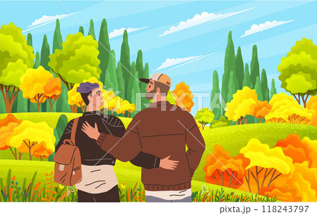 Two friends walking arm in arm through a vibrant autumn forest. The trees are bursting with bright yellow, orange, and green leaves, creating a warm and inviting natural setting. 118243797