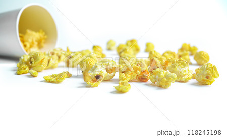 Isolated image of popcorn in a paper cup set against a white background, showcasing the fluffy, golden kernels spilling over the edges, perfect for themes related to snacks, cinema, or casual dining. Isolated image of popcorn in a paper cup set against a white background, showcasing the fluffy, golden kernels spilling over the edges, perfect for themes related to snacks, cinema, or casual dining. 118245198