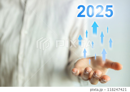 A person is holding a hand up with a blue and white background 2025 concept A person is holding a hand up with a blue and white background 2025 concept 118247421