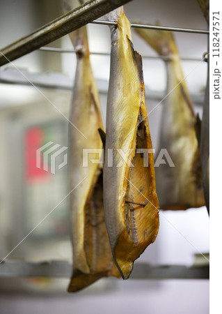 Smoked mackerel close-up. Fishing industry.Mackerel in a smoking oven. 118247571