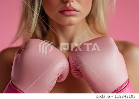Woman wearing pink boxing gloves 118248105