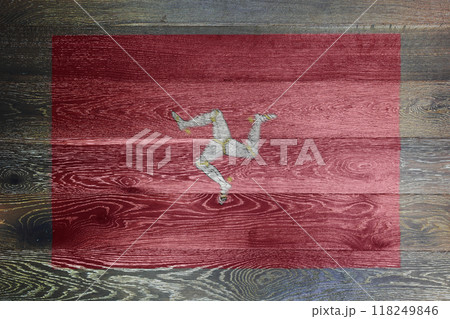 Isle of man flag on rustic old wood surface background 118249846