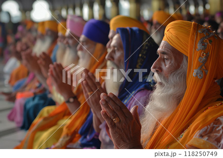 Sikh devotees singing hymns at golden temple Sikh devotees singing hymns at golden temple 118250749
