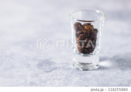 Aromatic flavorful Roasted Specialty Coffee Beans on white Background Aromatic flavorful Roasted Specialty Coffee Beans on white Background 118255860