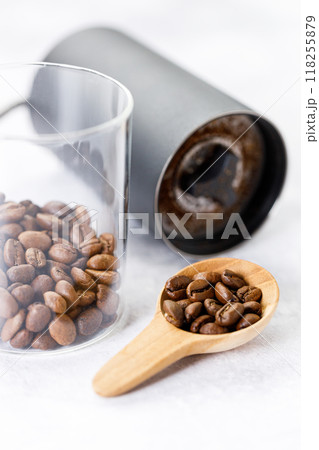 Aromatic flavorful Roasted Specialty Coffee Beans with grinder on white Background Aromatic flavorful Roasted Specialty Coffee Beans with grinder on white Background 118255879