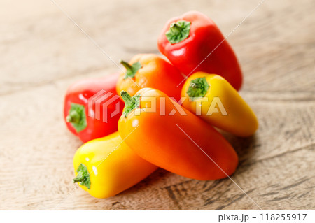 Colorful Sweet Pepper Chili, Baby Small Bell Pepper on wooden background Colorful Sweet Pepper Chili, Baby Small Bell Pepper on wooden background 118255917