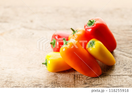 Colorful Sweet Pepper Chili, Baby Small Bell Pepper on wooden background 118255918