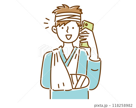 腕を骨折して、頭に包帯を巻いて笑顔で電話する若い男性 118258982