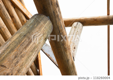 Rural wooden house made of logs is under construction, close-up Rural wooden house made of logs is under construction, close-up 118260004