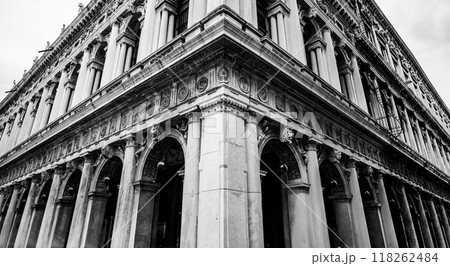 The striking architectural features of the New Procuracies at Saint Marc Square highlight Venetian craftsmanship, with elegant columns and intricate designs that showcase its historic charm. The striking architectural features of the New Procuracies at Saint Marc Square highlight Venetian craftsmanship, with elegant columns and intricate designs that showcase its historic charm. 118262484