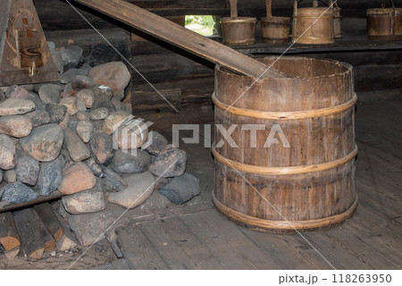 Old wooden wooden barrel in the bathhouse in old country house 118263950