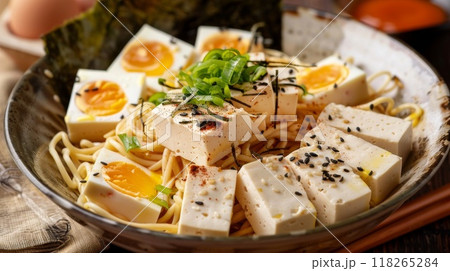 Japanese ramen noodle with tofu and egg on wooden table 118265284