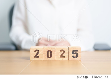 2025 year calendar block on table. goal, Resolution, strategy, plan, start, budget, mission, action, motivation and New Year concepts 118265933