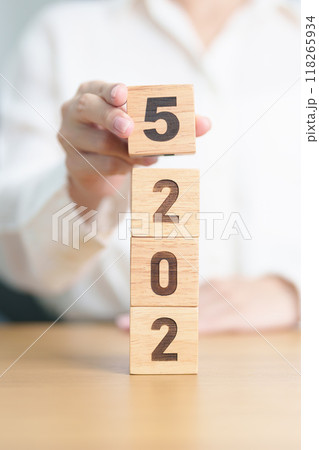 2025 year calendar block on table. goal, Resolution, strategy, plan, start, budget, mission, action, motivation and New Year concepts 118265934